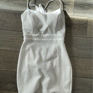 White mini bodycon dress with open back lace zipper back and adjustable straps